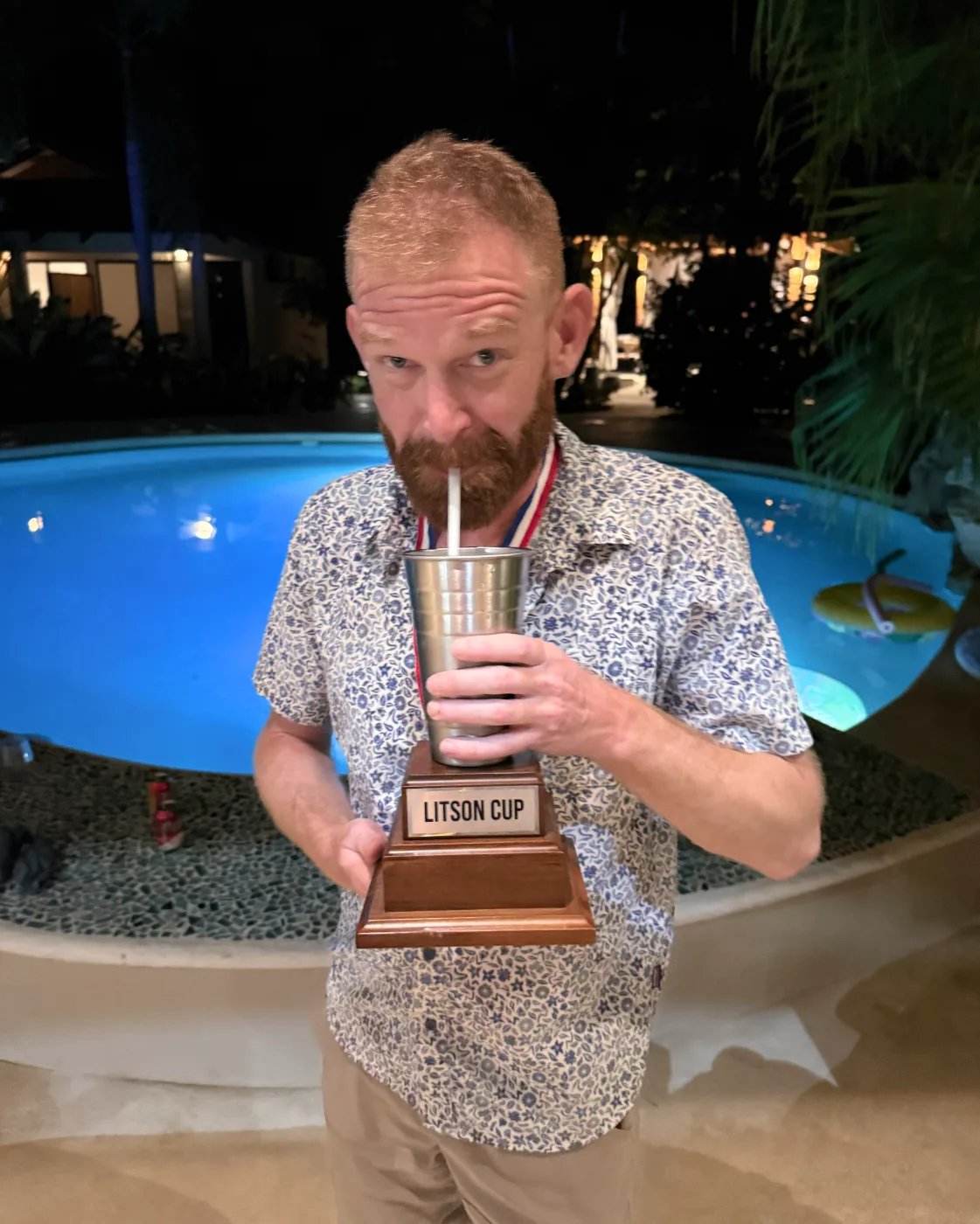 Winner drinking from the original Recess Cup trophy